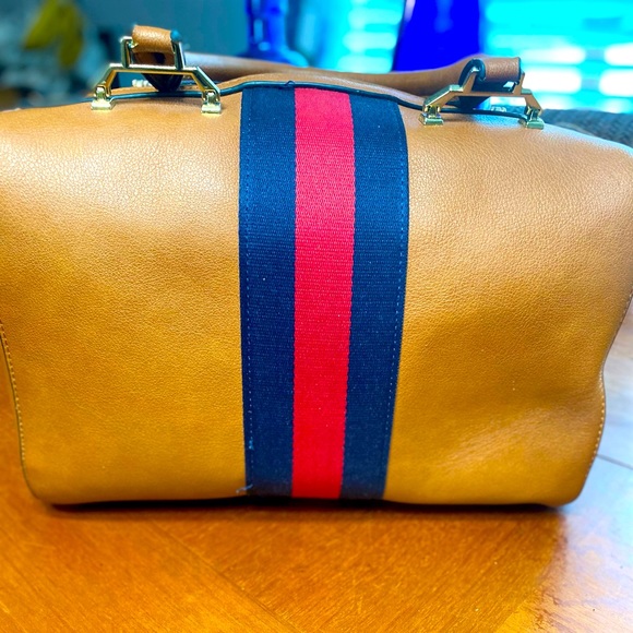 No name tan cute duffle style purse. With black and red stripe. - Picture 2 of 4